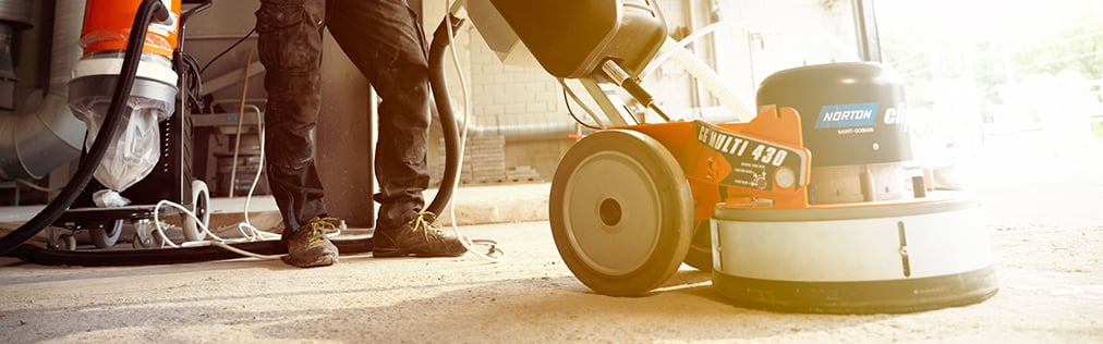 Floor grinding machine in use on a construction site
