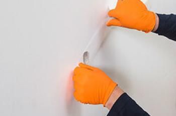Repairing drywall by applying mesh
