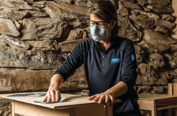 Hand sanding furniture with sandpaper
