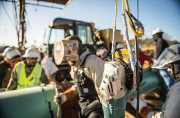 Image of welder working on a pipeline