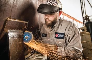 Man grinding with a Norton BlueFire flap disc