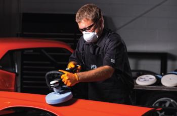 Man polishing automobile