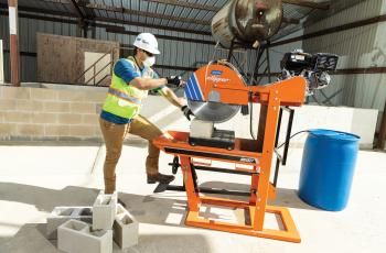 Man cutting a block with a Norton Clipper masonry saw