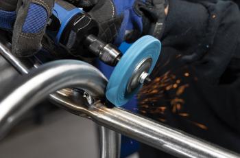 Operator using a Norton Vortex Rapid Blend unified disc