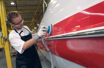 composite sanding on a red hull