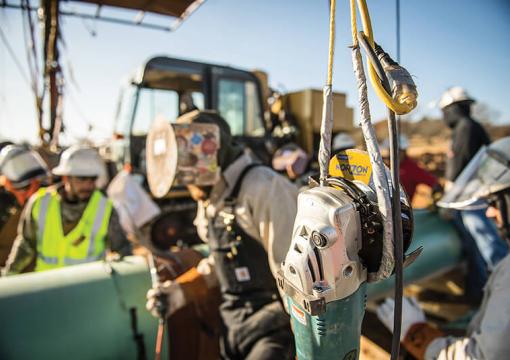 Image of welder working on a pipeline