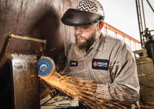 Man grinding with a Norton BlueFire flap disc