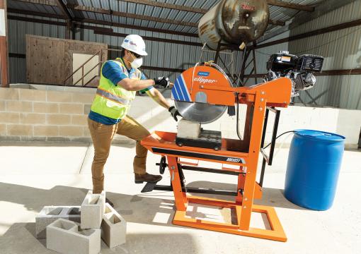 Man cutting a block with a Norton Clipper masonry saw