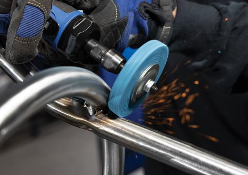 Operator using a Norton Vortex Rapid Blend unified disc