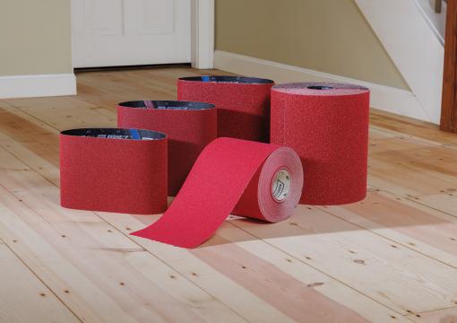 Norton Red Heat belts and rolls on a wood floor