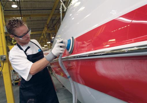 composite sanding on a red hull