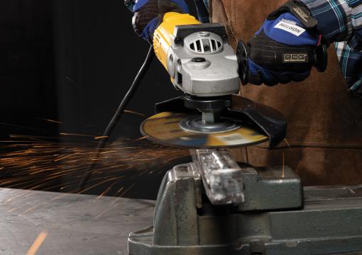 Close up of an operator using a 9" Norton Quantum3 depressed center wheel