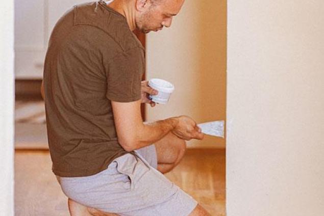 Man working on a wall