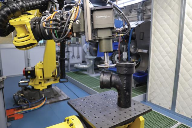Grinding a part in the APS lab