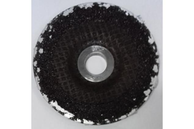 Stuck metal on a standard grinding wheel after being used on aluminum