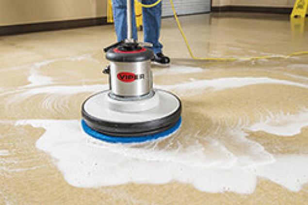 Electric burnisher with blue super clean floor pad