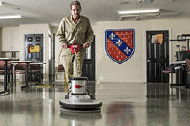 Electric burnisher with a grizzly bear light burnish floor pad