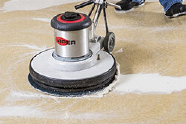 Electric burnisher with ultra blue stripper floor pad