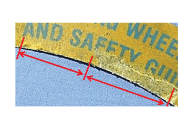 Scratches, tears, and other wear marks on a grinding wheel