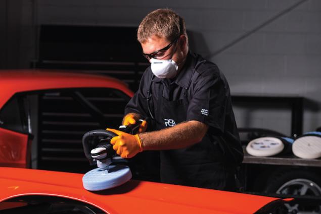man polishing automobile