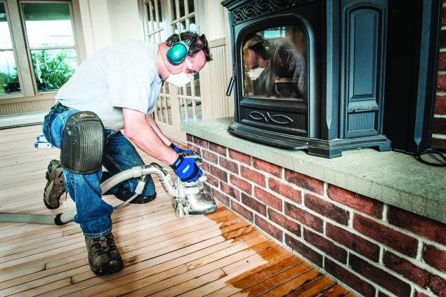 Man using an edge sander on a wood floor