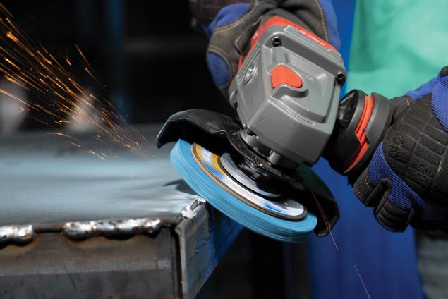 Operator using Norton Vortex Rapid Blend depressed center disc