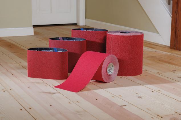 Norton Red Heat belts and rolls on a wood floor