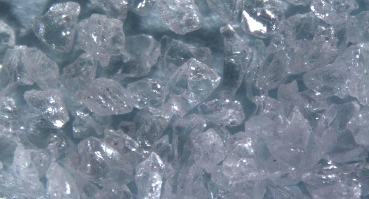 Figure 3. Aluminum oxide is a strong, blocky-shaped abrasive grain. While the initial edge of the grain is sharp, it rapidly dulls. With broad cleavage lines, the grain continues to wear until enough pressure is created to fracture the grain and create a new sharp cutting edge.	