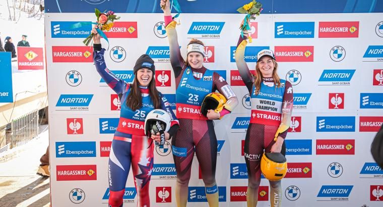 luge athletes celebrating win