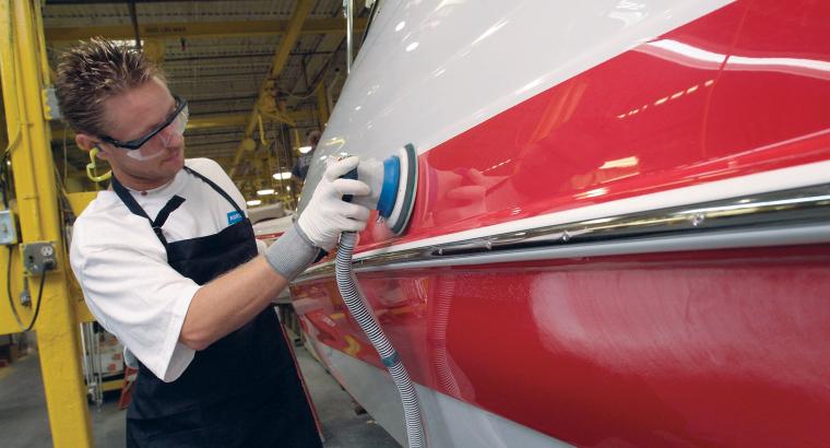 composite sanding on a red hull