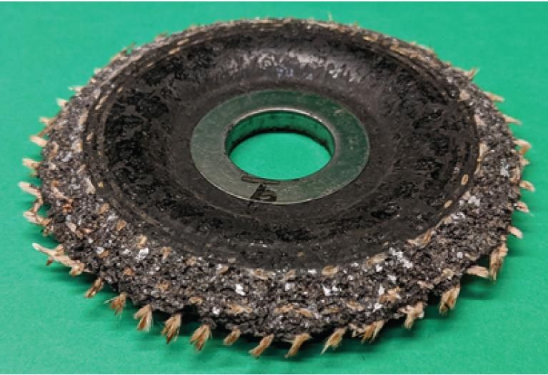 Norton for aluminum grinding wheel shows minimal loading when compared to the competitor wheel.