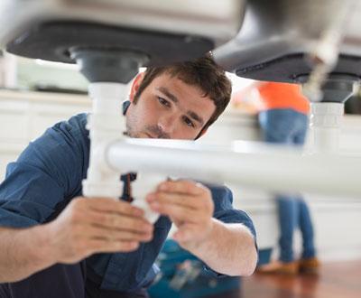 plumber-under-sink